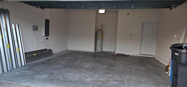 garage featuring electric panel and water heater