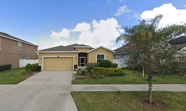 view of front facade with a front lawn and a garage