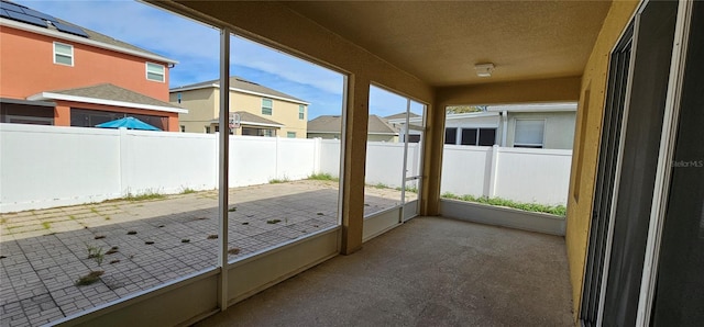 unfurnished sunroom featuring plenty of natural light