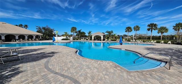 view of swimming pool with a patio area