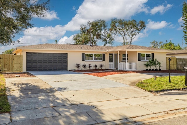 ranch-style house featuring a porch and a garage