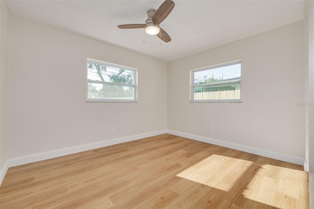 spare room with light hardwood / wood-style flooring and ceiling fan