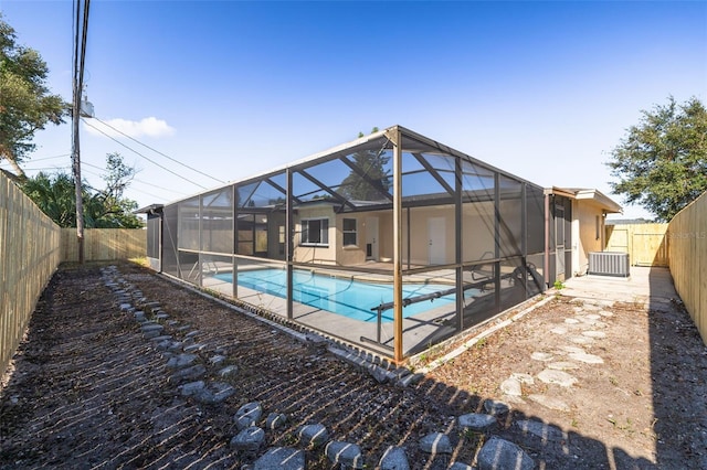 view of pool with a patio and a lanai