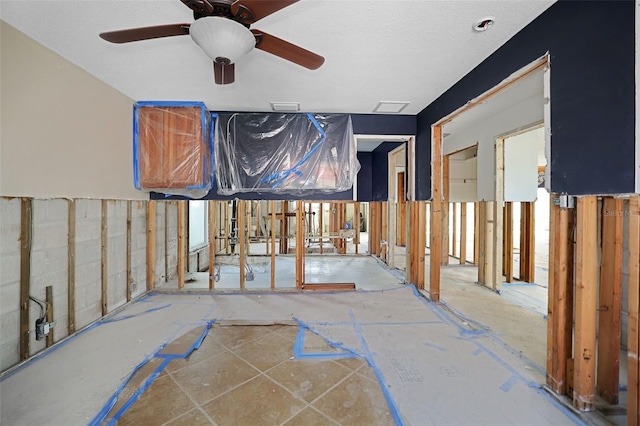 interior space featuring ceiling fan