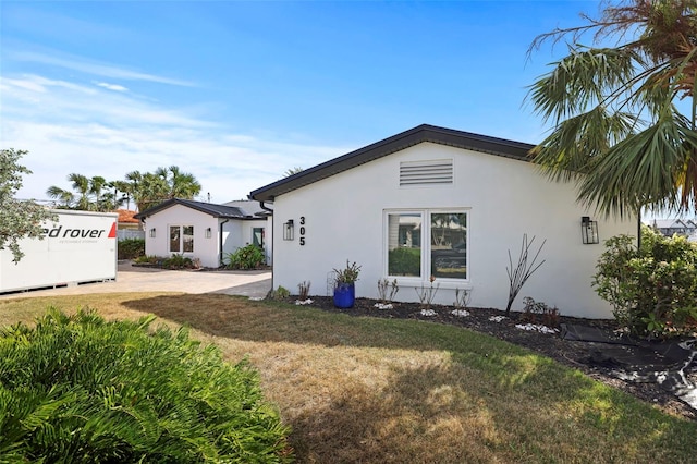 rear view of house with a lawn