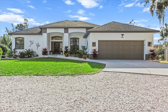 view of front facade featuring a garage and a front yard