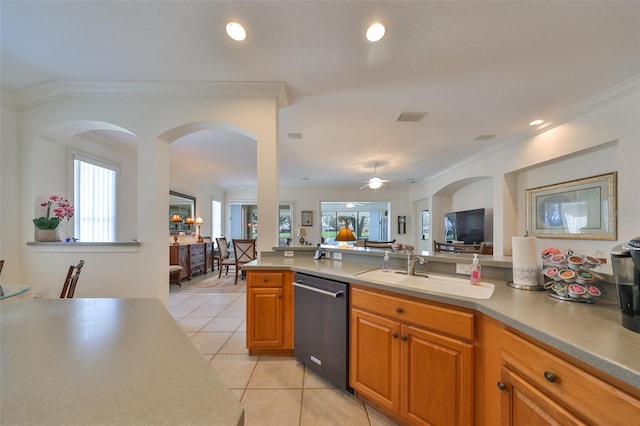 1120 Emerald Dunes Dr, Sun City Center, FL 33573 - kitchen with dishwasher, a sink, light tile patterned flooring, ornamental molding, and open floor plan