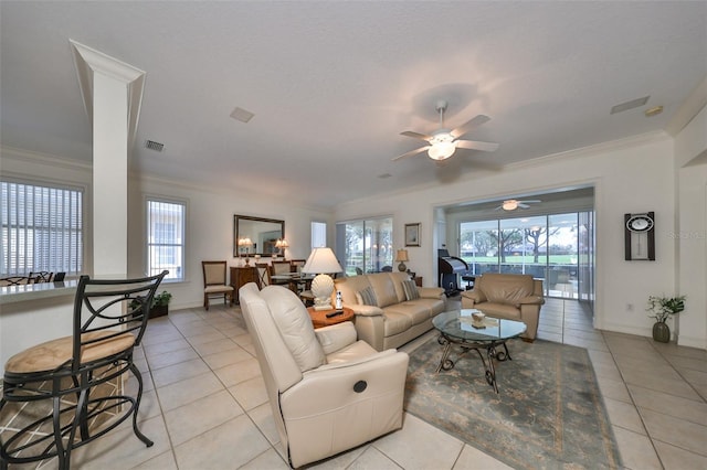 1120 Emerald Dunes Dr, Sun City Center, FL 33573 - living area with light tile patterned floors, a ceiling fan, crown molding, and baseboards