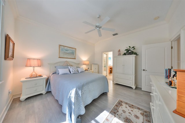 bedroom with connected bathroom, ceiling fan, crown molding, and hardwood / wood-style flooring