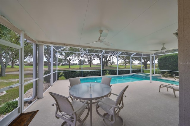 view of swimming pool featuring ceiling fan, an in ground hot tub, a patio, and glass enclosure