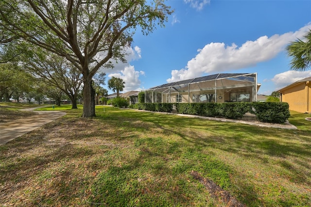 1120 Emerald Dunes Dr, Sun City Center, FL 33573 - view of grassy yard with glass enclosure
