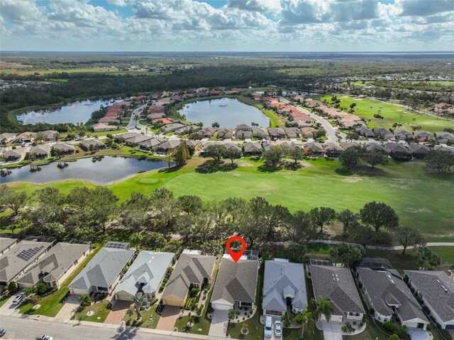 1120 Emerald Dunes Dr, Sun City Center, FL 33573 - aerial view of property's location featuring nearby suburban area, a large body of water, and a golf course