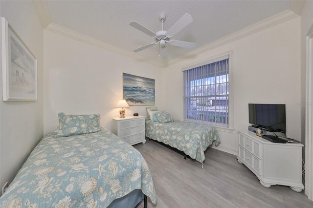 bedroom with ceiling fan, crown molding, and light wood-type flooring