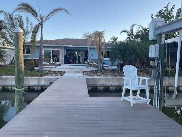 dock area with a water view