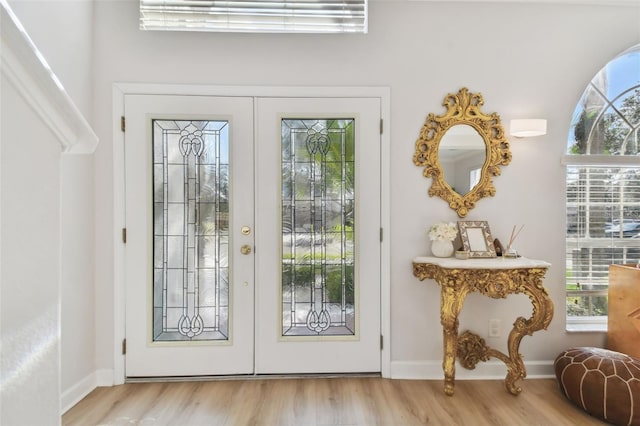 entryway featuring french doors and light wood-type flooring