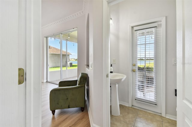 doorway to outside featuring light tile patterned floors