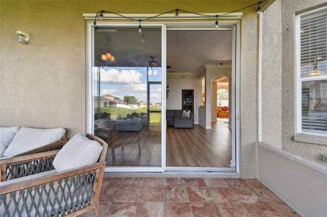 view of exterior entry with a patio