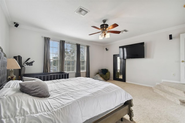 bedroom with ceiling fan, light colored carpet, and crown molding