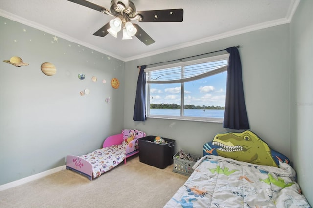 bedroom featuring carpet flooring, a water view, ceiling fan, and crown molding