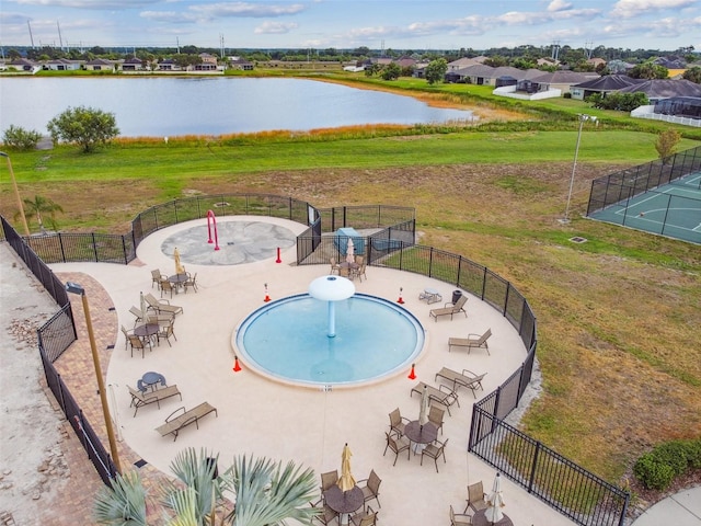 view of pool with a water view