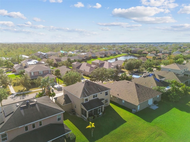 bird's eye view with a residential view and a water view