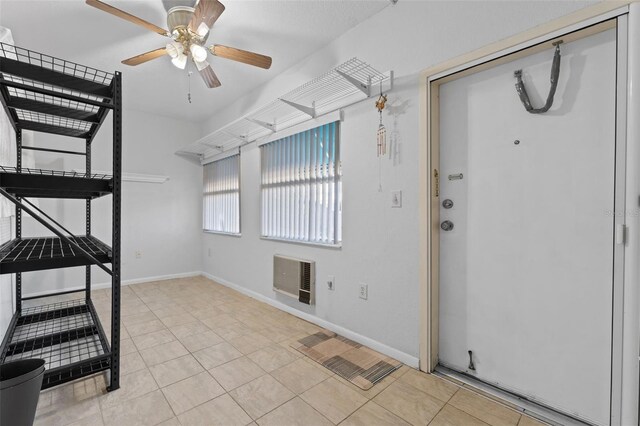 interior space featuring ceiling fan and heating unit