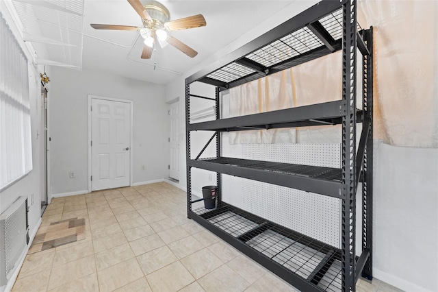 interior space featuring ceiling fan