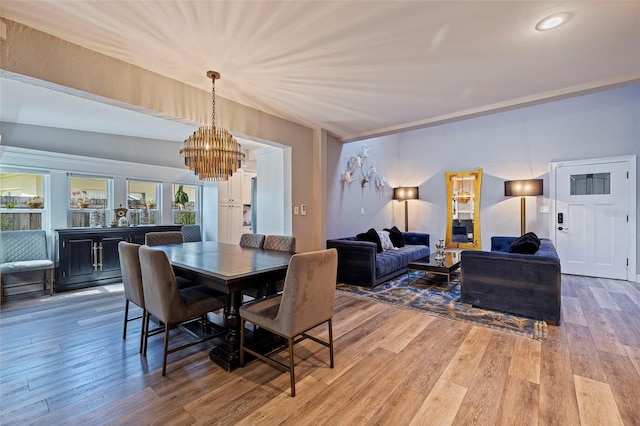 dining space featuring a chandelier and hardwood / wood-style flooring