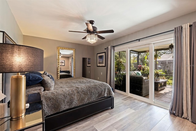 bedroom featuring access to outside, ceiling fan, and light hardwood / wood-style floors