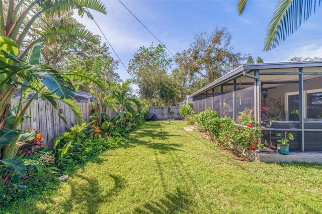 view of yard with a sunroom