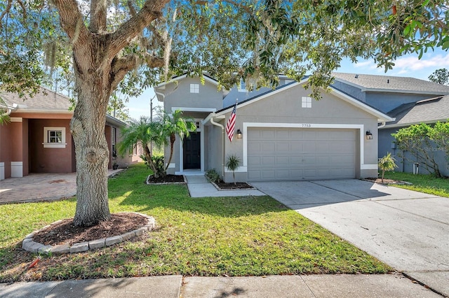 front facade with a front yard and a garage