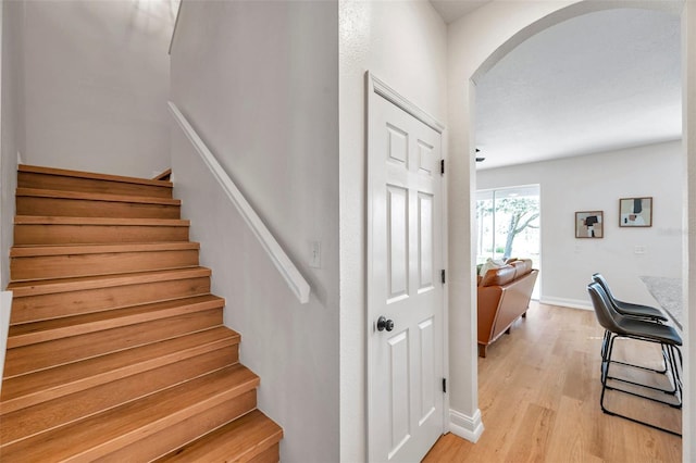 stairs with wood-type flooring