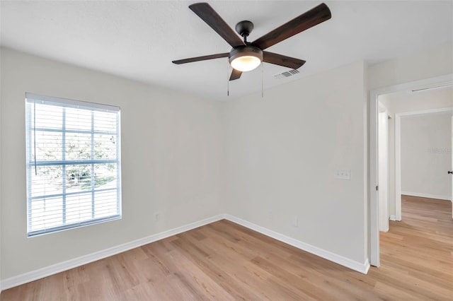 spare room featuring ceiling fan and light wood-type flooring