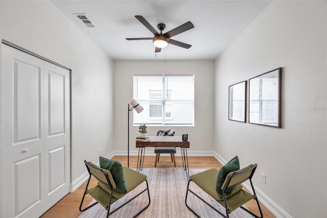 sitting room featuring light hardwood / wood-style flooring and ceiling fan