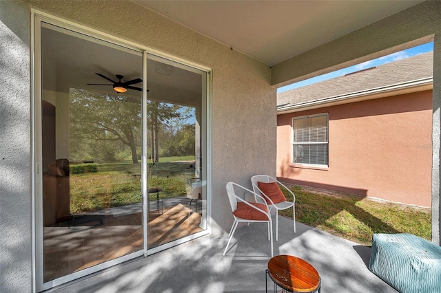 exterior space with ceiling fan