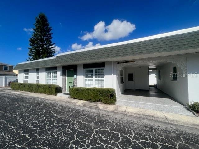 view of front of property with a carport