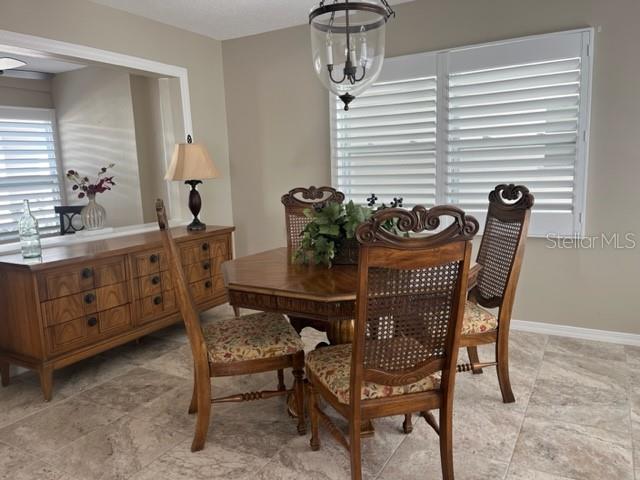 dining room featuring a notable chandelier