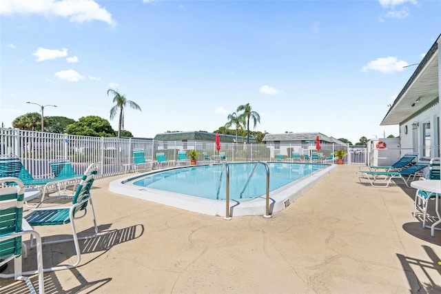 view of swimming pool with a patio