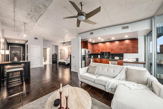 tiled living room with ceiling fan