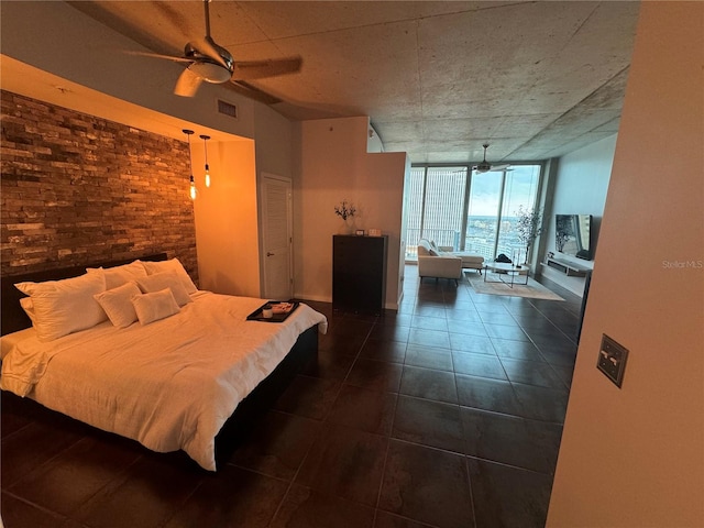 tiled bedroom with floor to ceiling windows and ceiling fan