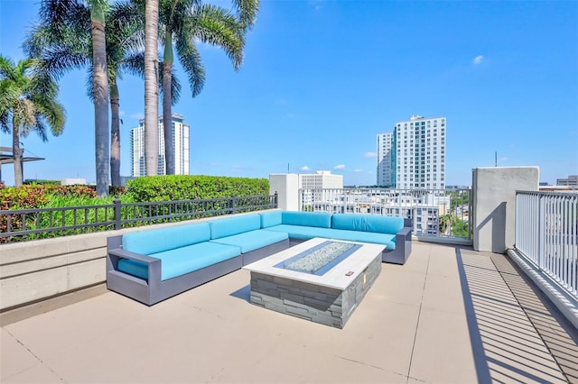 view of patio / terrace with an outdoor living space with a fire pit