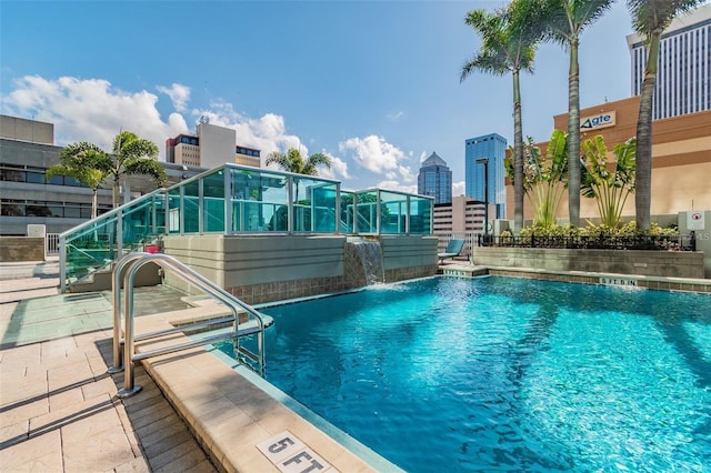 view of swimming pool featuring pool water feature