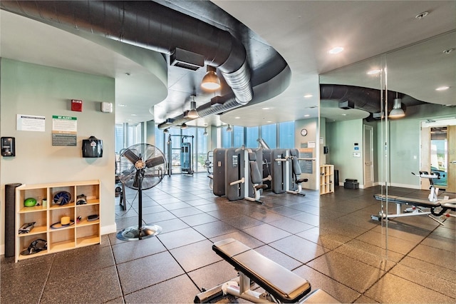 workout area with a wealth of natural light and a wall of windows