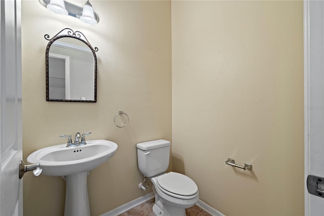 bathroom featuring toilet