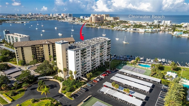 birds eye view of property with a water view