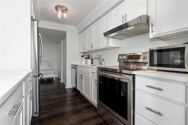 kitchen featuring ornamental molding, dark wood-type flooring, stainless steel appliances, and white cabinets