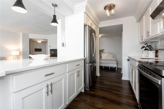 kitchen featuring white cabinetry, pendant lighting, stainless steel appliances, and wall chimney range hood