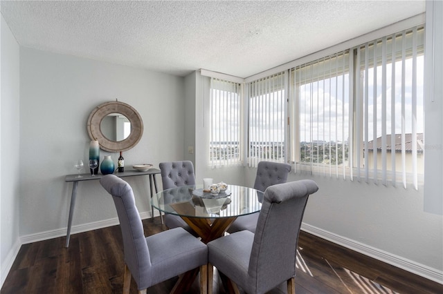 dining area featuring plenty of natural light, dark hardwood / wood-style floors, and a textured ceiling