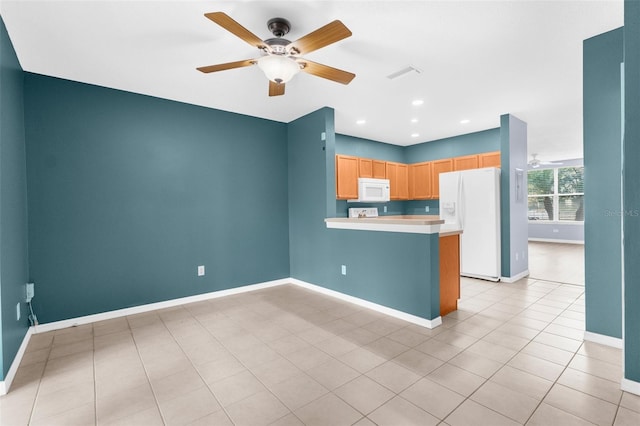 kitchen featuring kitchen peninsula, light tile patterned floors, white appliances, and ceiling fan