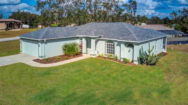 view of front of house with a garage and a front lawn